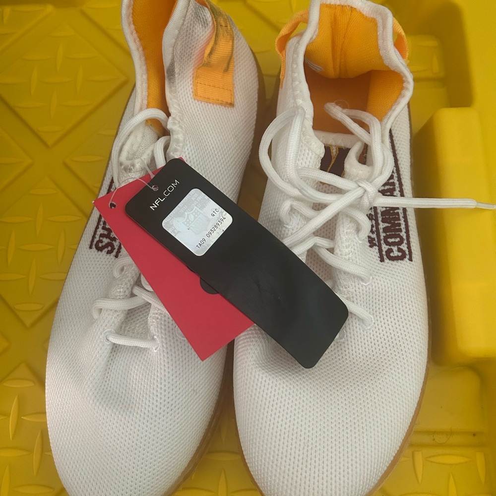 White and Orange Athletic Shoes
